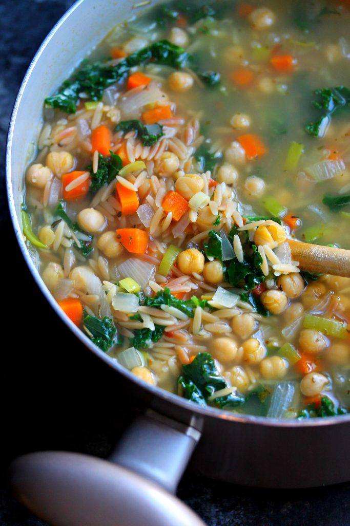 Lemon Dill Chickpea Orzo Soup in the pot, finished with fresh lemon juice and chopped dill for a bright, fresh flavor.