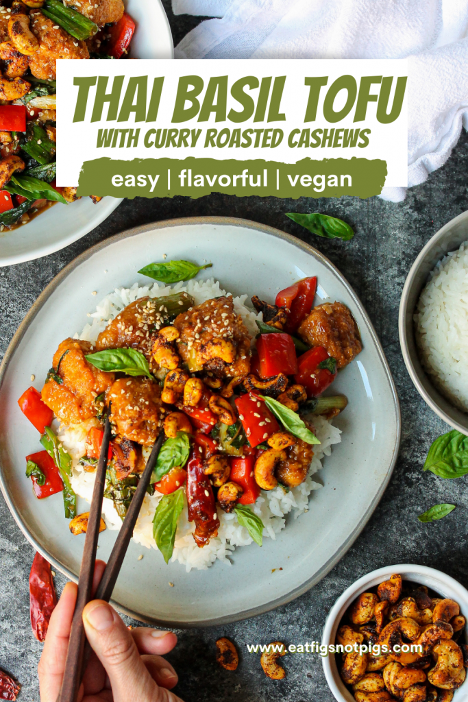 A serving of Thai Basil Tofu with Curry Roasted Cashews garnished with fresh Thai basil and toasted sesame seeds.