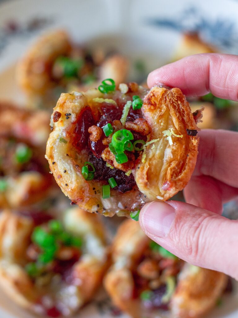 Close-up of the creamy herbed vegan cream cheese filling with visible flecks of green onion and minced garlic.